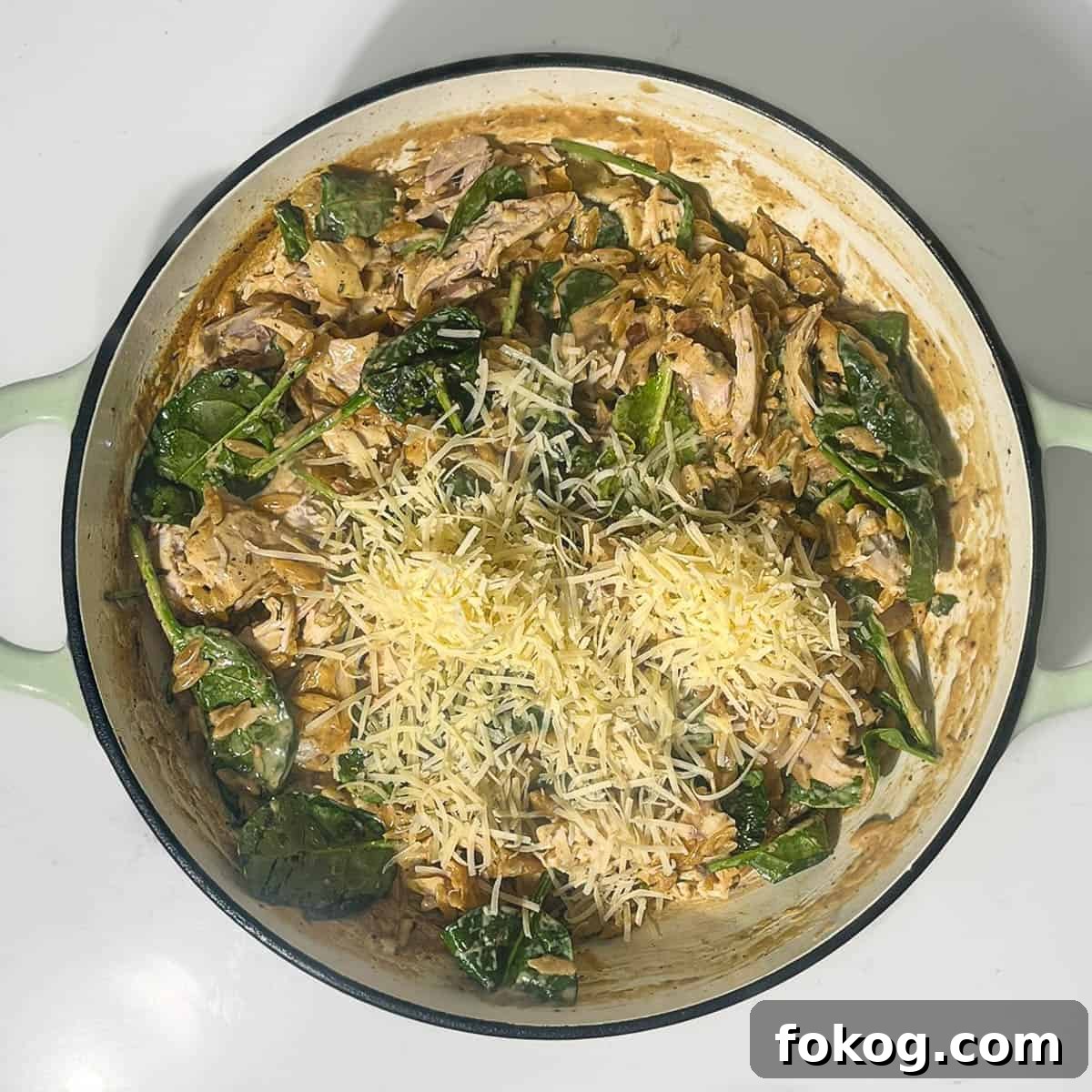 Creamy Lemon Chicken Orzo — One-Pot Weeknight Dinner 15 Adding parmesan and lemon juice to the orzo pasta.