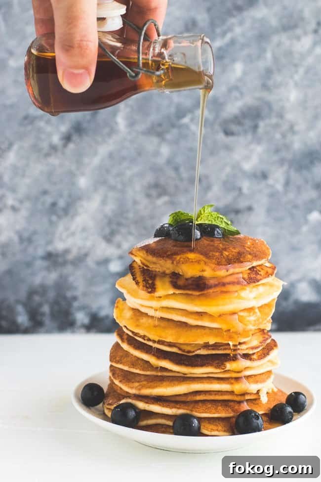 Fluffy Keto Pancakes Topped with Pure Maple Syrup 2 Keto Pancakes with maple syrup