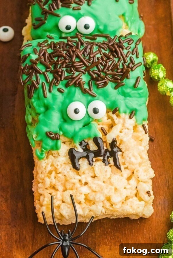 Sweet Grape Jelly Meatballs with Tangy Glaze Recipe 10 Decorated Frankenstein rice krispies treats on a wooden board.