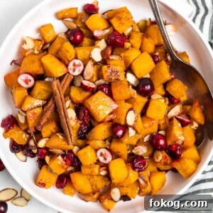 Overhead view of white bowl with maple roasted butternut squash.