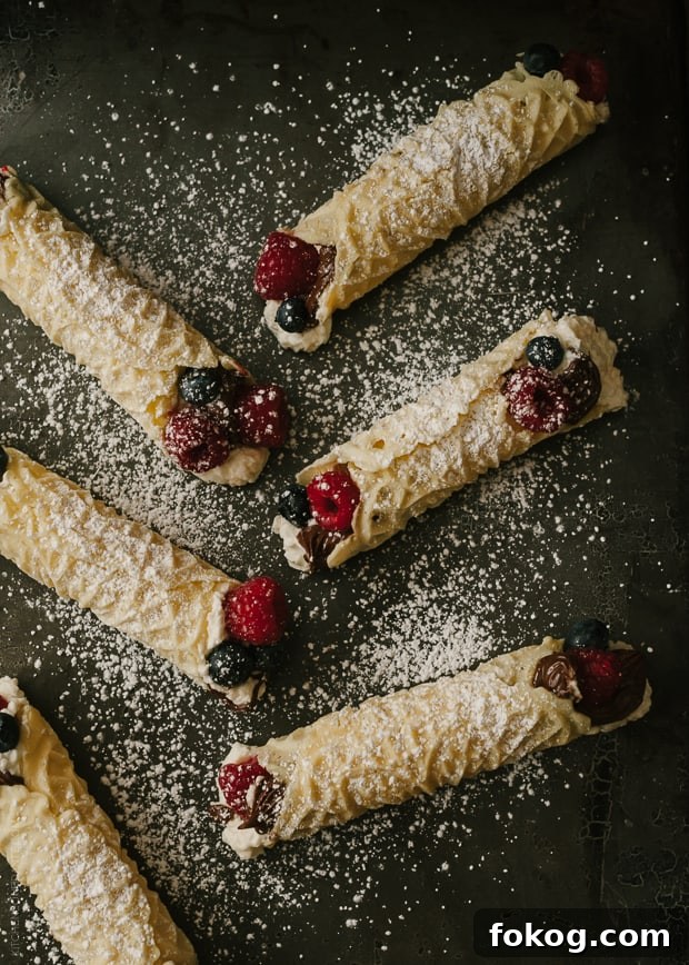 Nutella and Berry-Filled Pizzelle Waffle Cookies 7 Rolled Waffle Cookies (Pizzelle) sprinkled with powdered sugar.