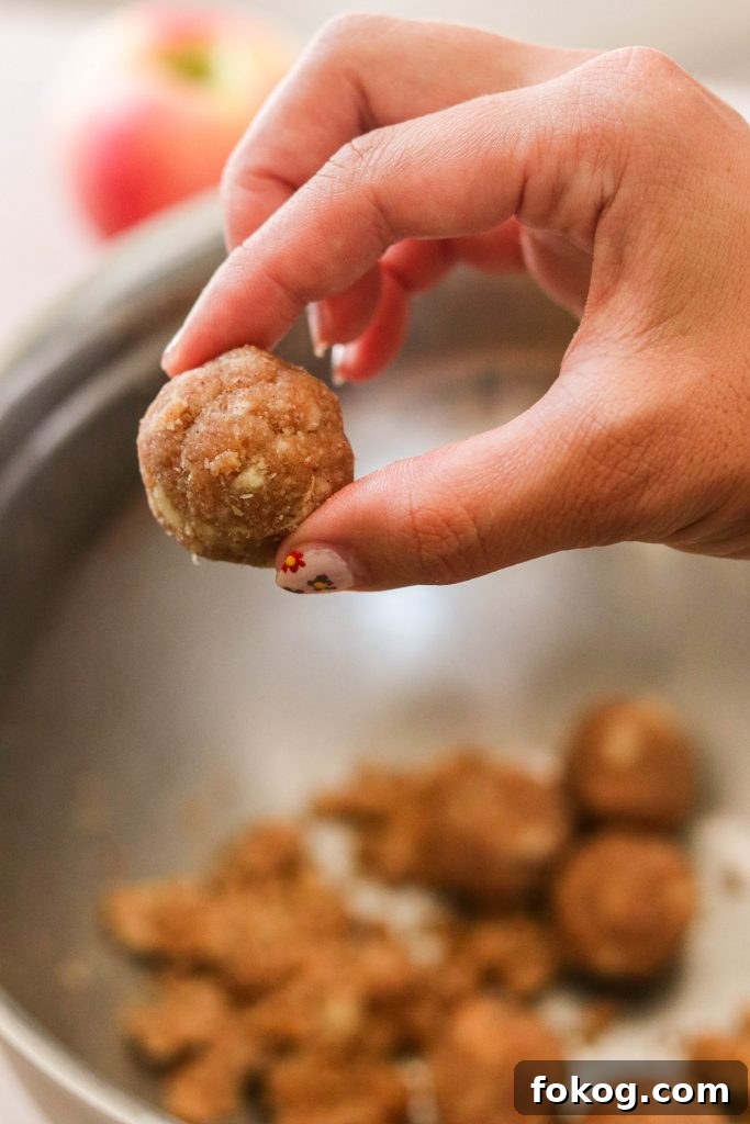 No-Bake Paleo and Vegan Apple Cinnamon Donut Holes 3 Making paleo donut holes and rolling them in a ball