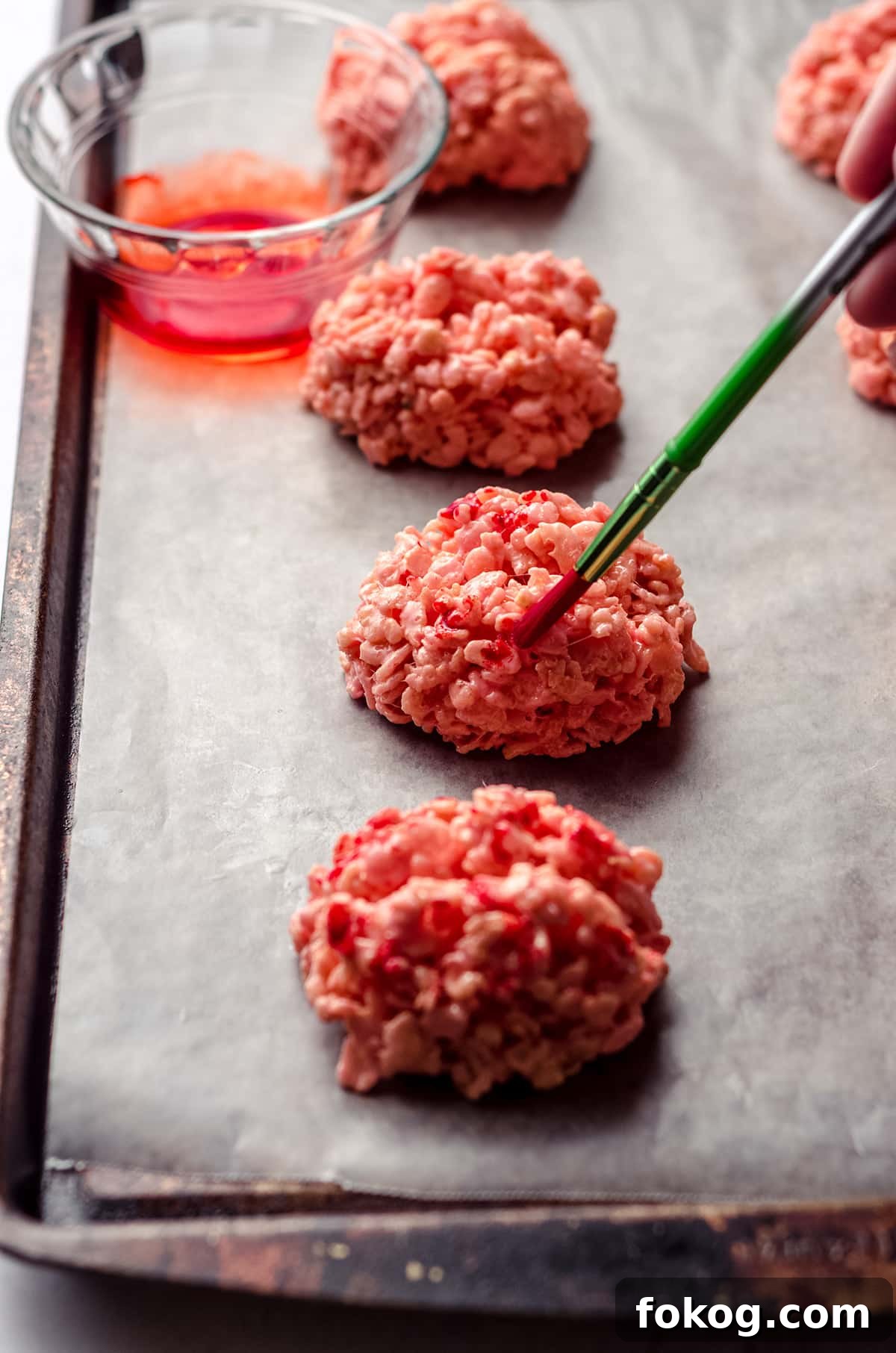 Rice Krispies Brains Recipe: Spooky Halloween Treats Tutorial 12 brushing red food coloring onto rice krispies brains with a paintbrush