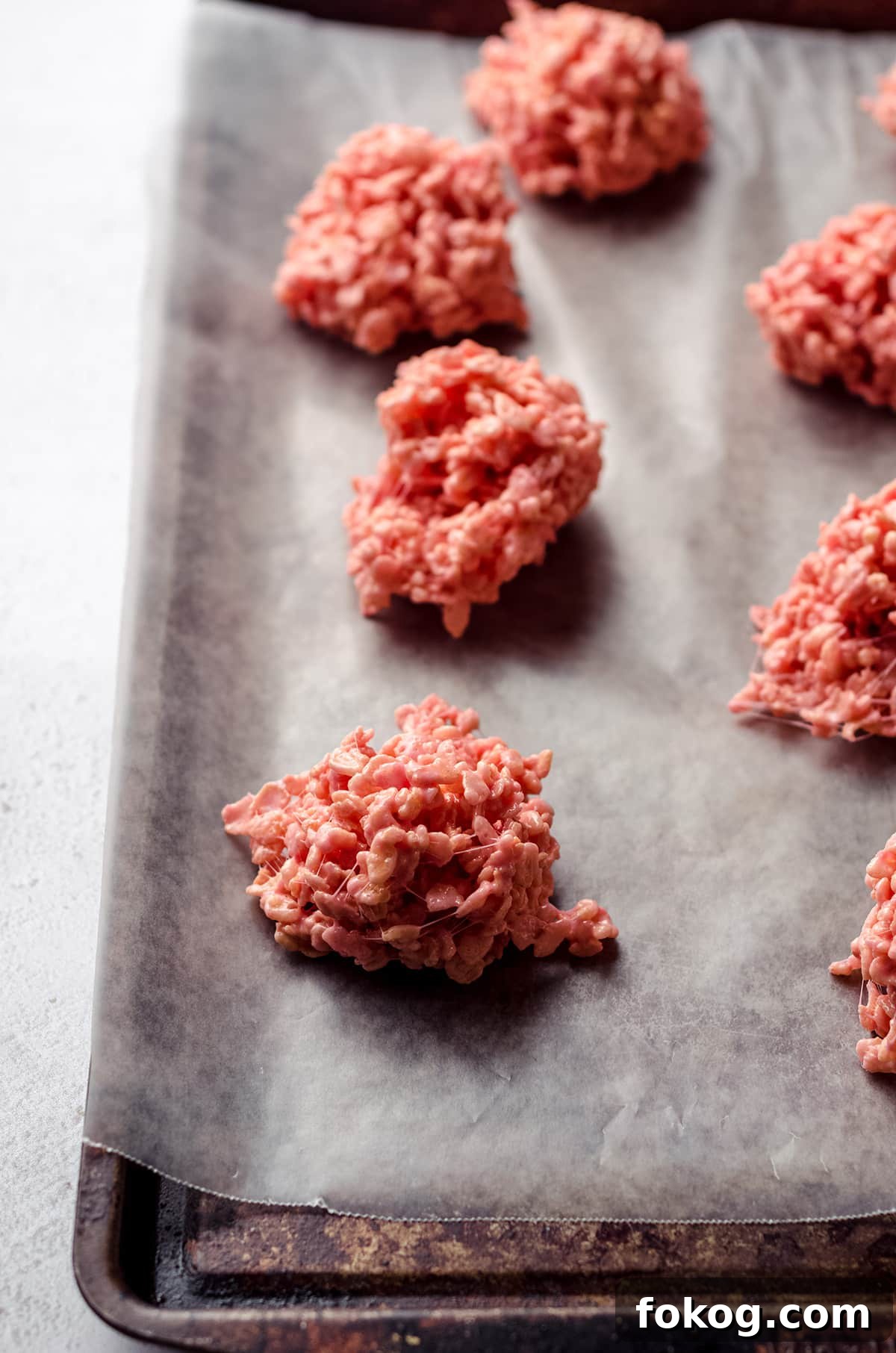 Rice Krispies Brains Recipe: Spooky Halloween Treats Tutorial 7 mounds of pink rice krispies treats on baking sheet to make brains