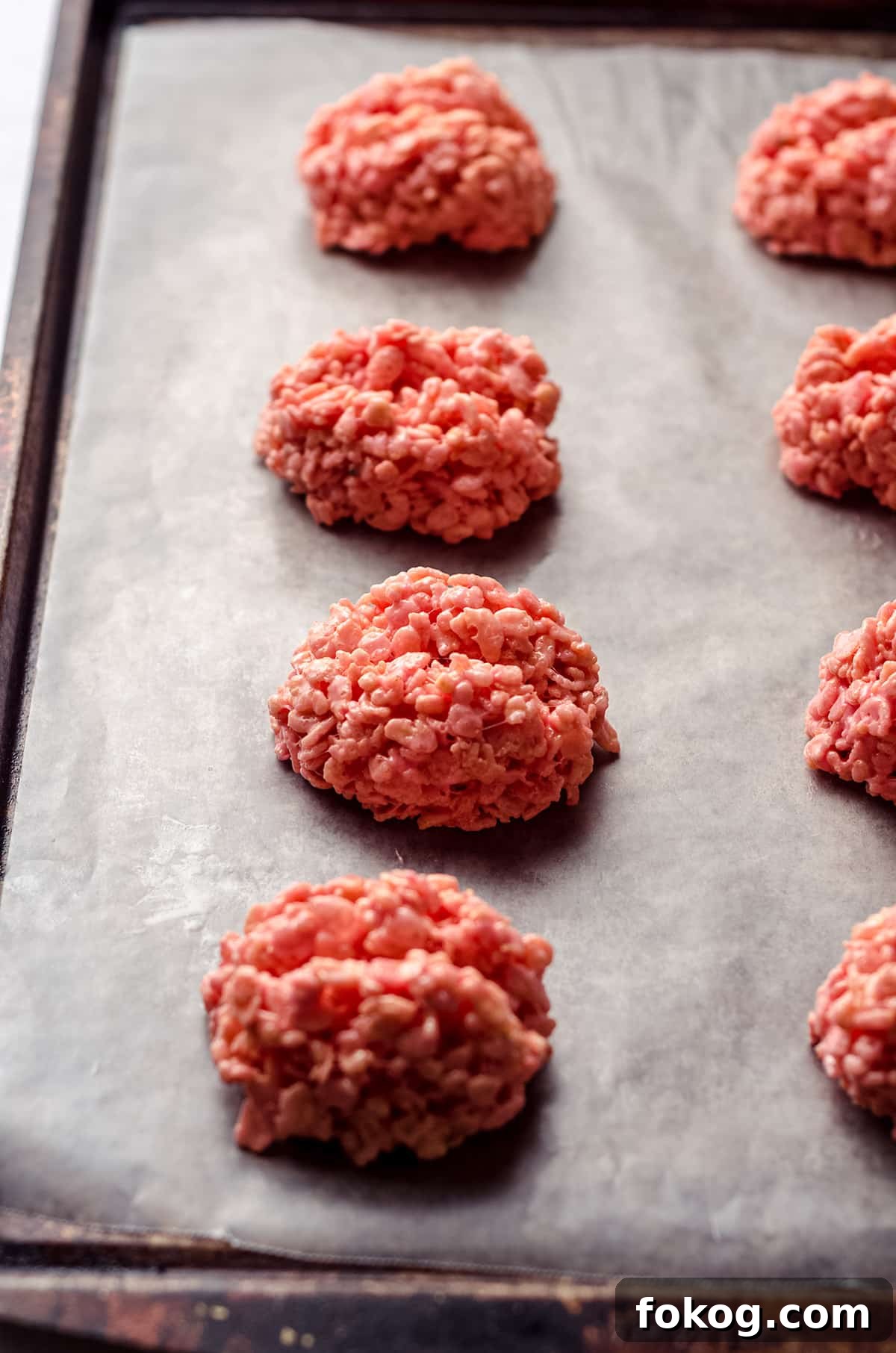 Rice Krispies Brains Recipe: Spooky Halloween Treats Tutorial 9 mounds of pink rice krispies treats on baking sheet to make brains