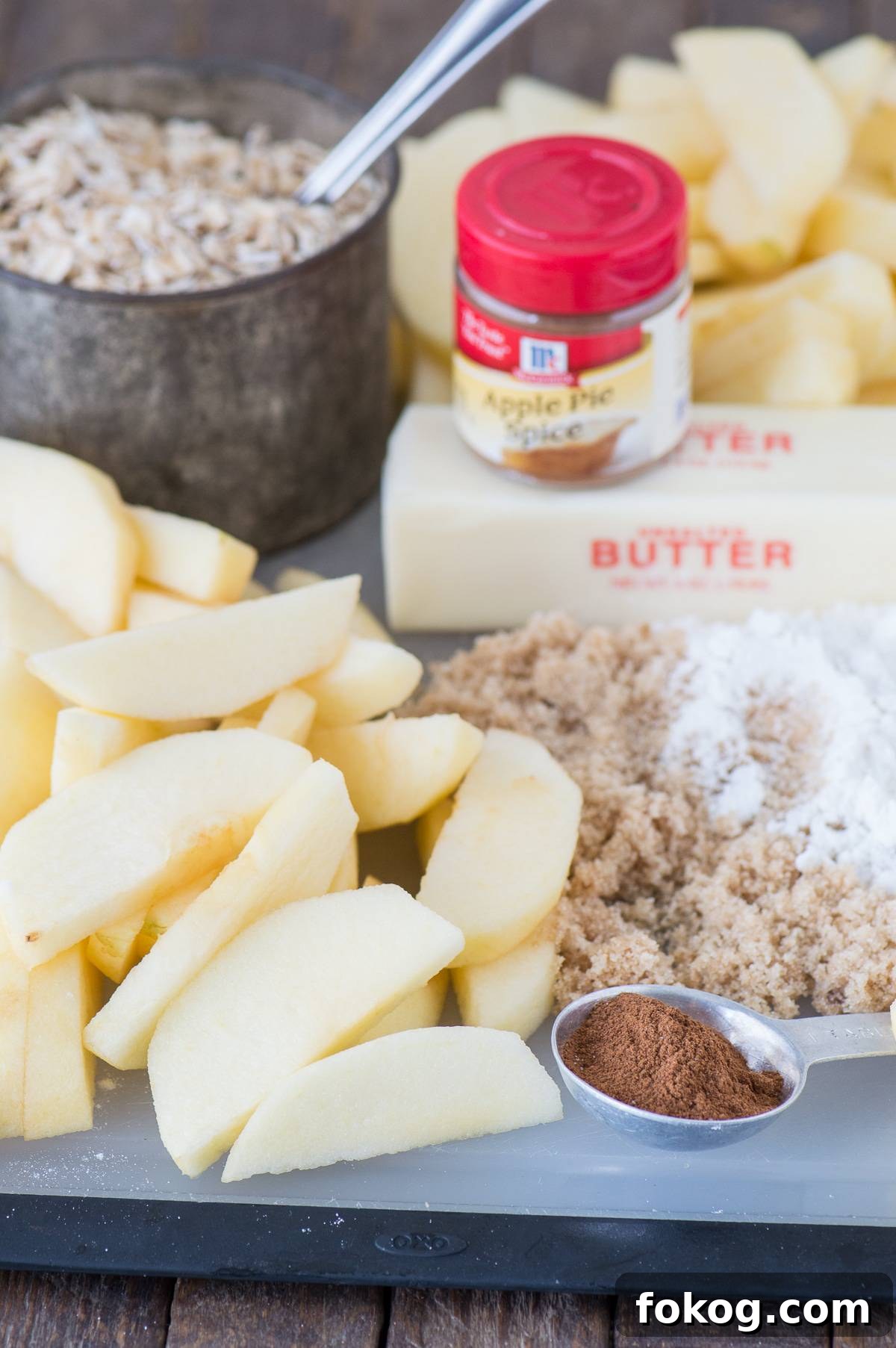 Slow-Cooker Apple Crisp with Cinnamon Oat Topping 4 ingredients to make crock pot apple crisp including apples, butter, brown sugar, cinnamon, and oats