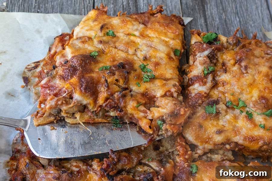 a slice of crazy crust cheesy loaded with toppings pizza, gluten free