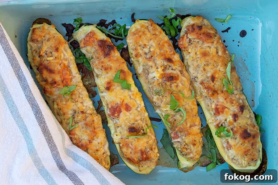 stuffed zucchini with cherry tomatoes and gooey melty two types of cheese, low carb