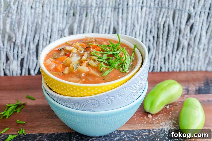 minestroni soup with beans and veggies cooked in an instant pot served in a bowl with herbs