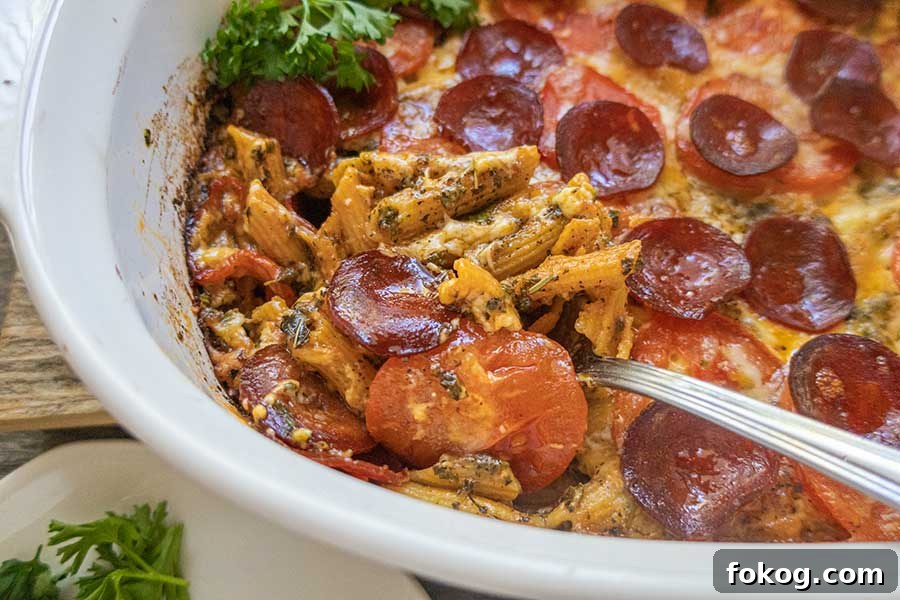 one pan creamy pepperoni pasta casserole topped with sliced circles of pepperoni, gluten free