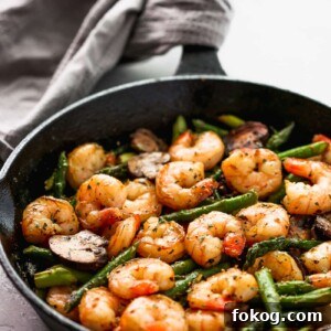 Garlic Butter Shrimp with Asparagus Recipe for Quick Weeknights 9 Sauteed shrimp, asparagus and mushrooms in a skillet.