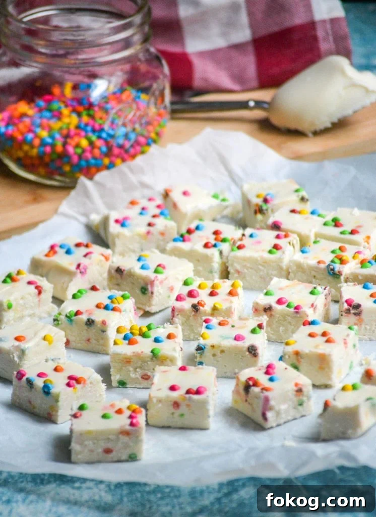 Rainbow Chip Fudge Recipe: Colorful, Creamy No-Bake Treat 39 rainbow chip fudge made from frosting shown on parchment paper