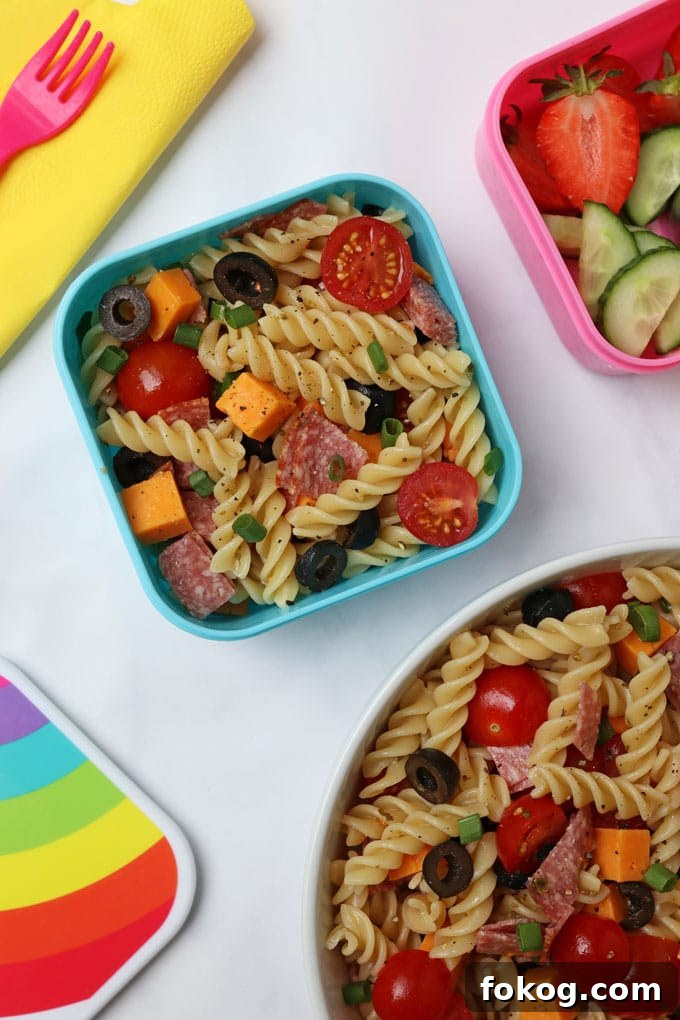 Pizza Pasta salad in a blue tupperware box.