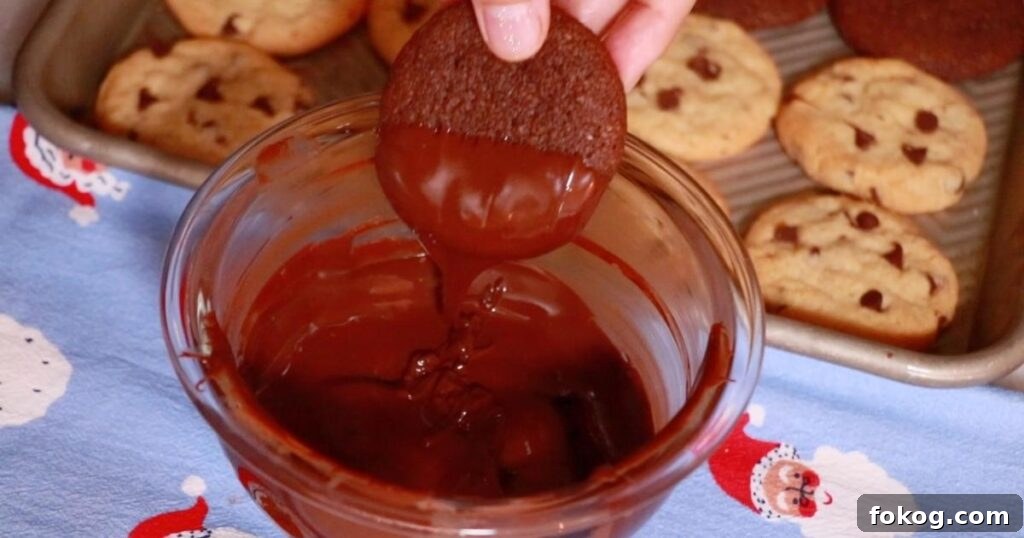 dipping chewy chocolate cookies in dark chocolate