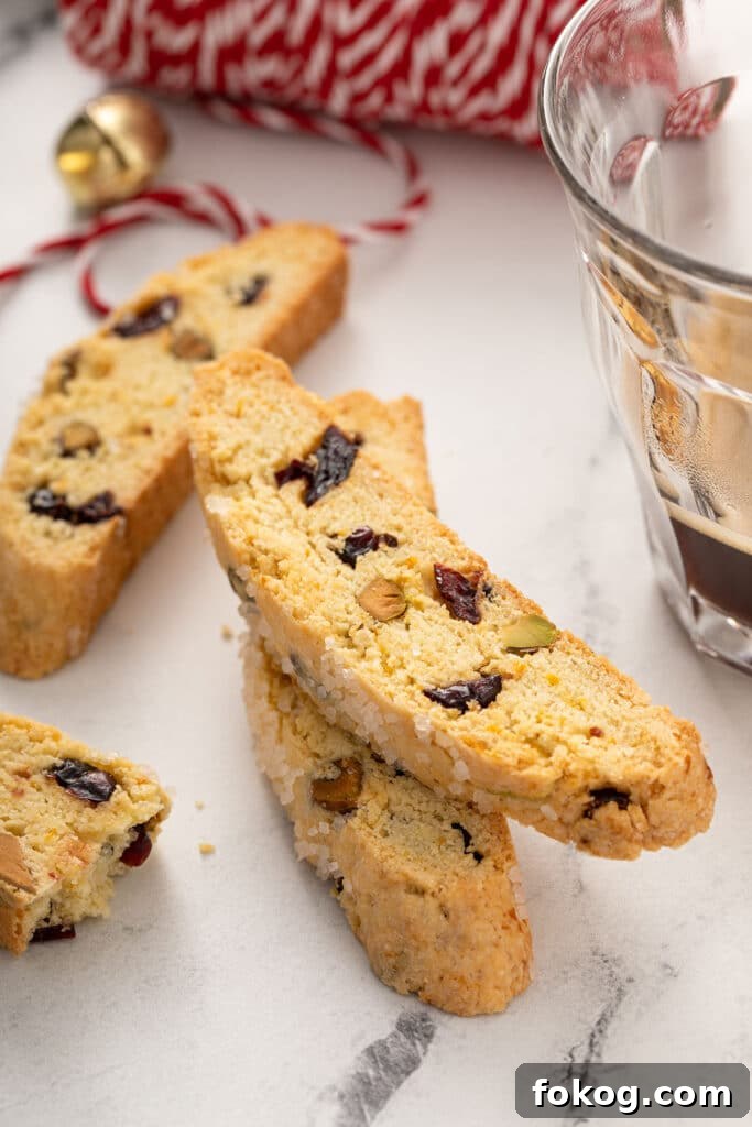 Cranberry, Orange & Pistachio Biscotti Recipe 8 Biscotti on a plate served with coffee
