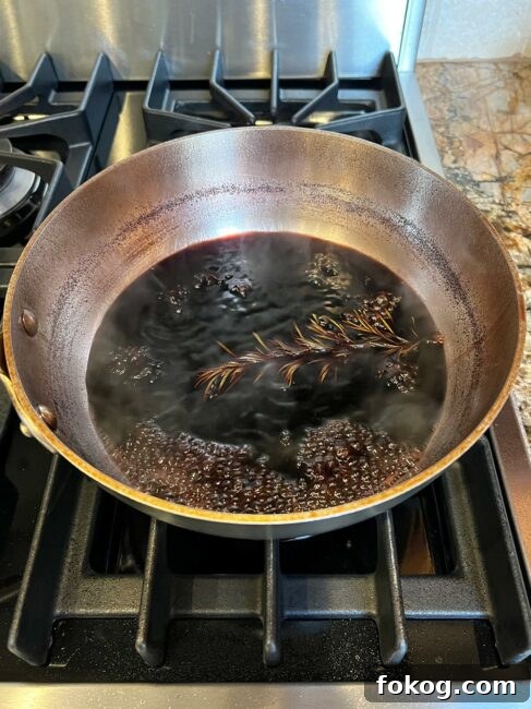 Pomegranate-Port Gravy with Rosemary for Roasts and Poultry 7 Pomegranate gravy mixture reduced.