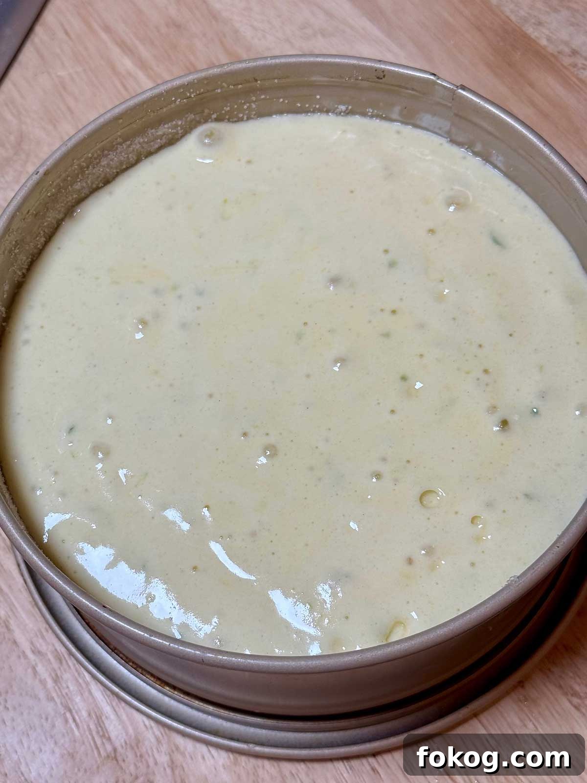 Sponge cake batter in a springform pan.