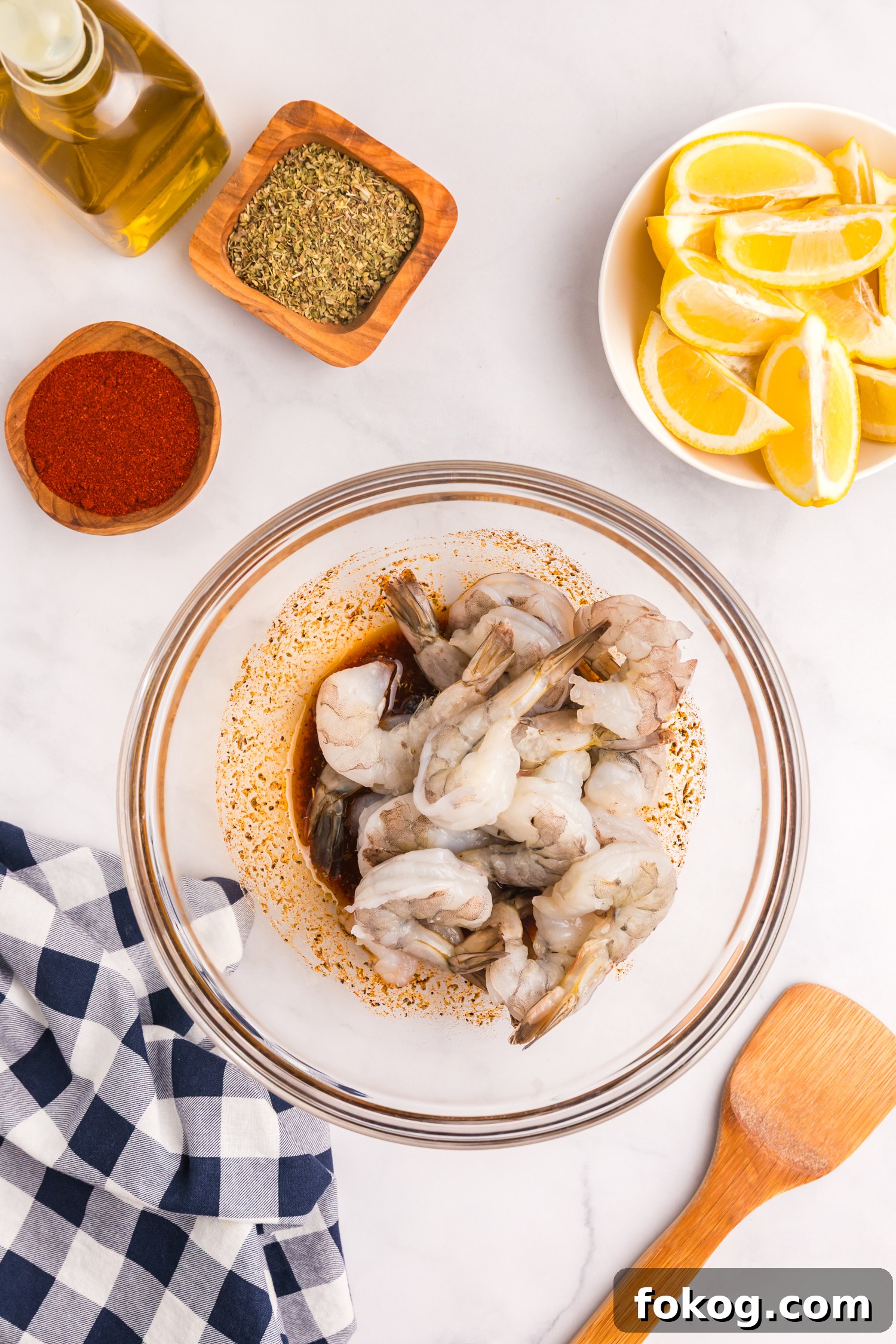 Perfect Grilled Shrimp Recipe for Juicy, Flavorful Results 6 Raw shrimp added to the bowl with the marinade, ready to be tossed.