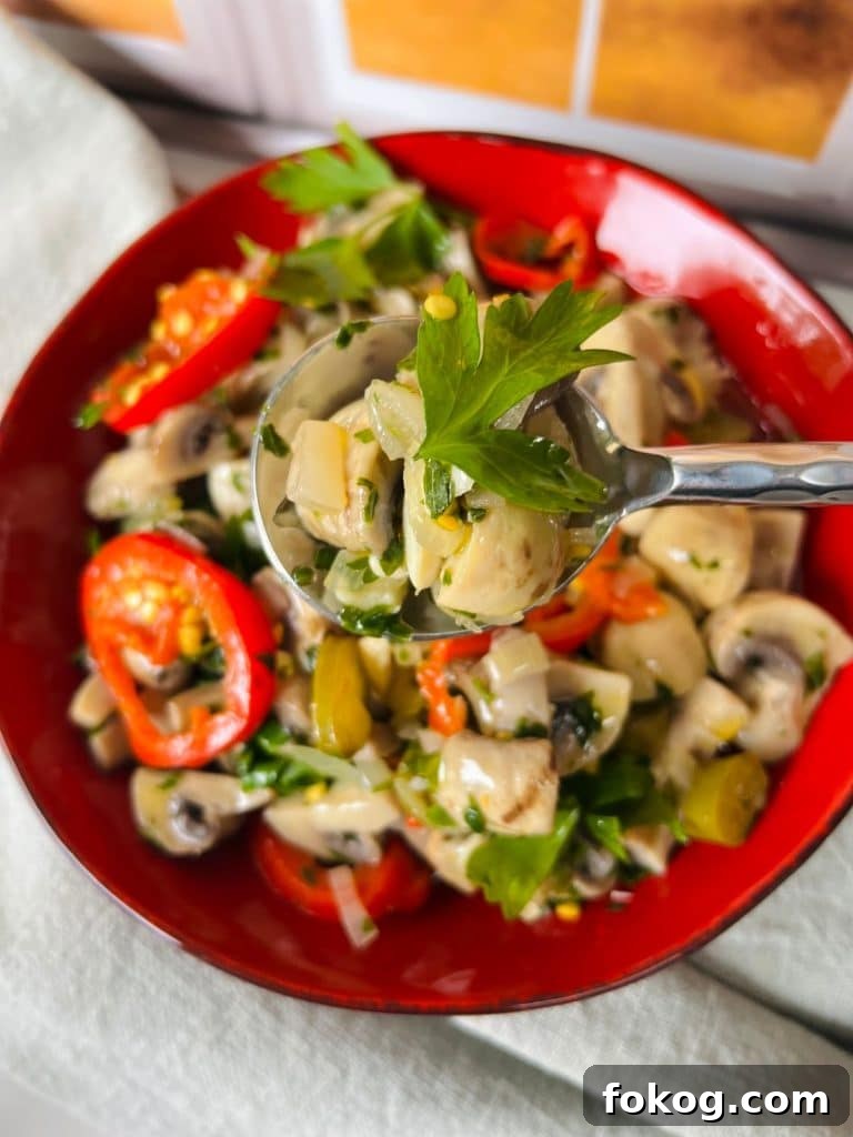 Spicy Italian Pickled Mushrooms Finished and Styled with Spoon.