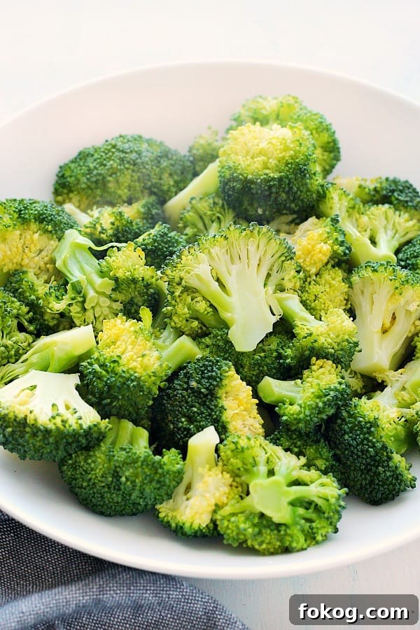 Steamed Broccoli Steamed broccoli in a white bowl.