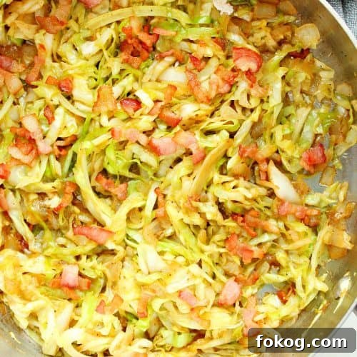 Fried cabbage in a pan.