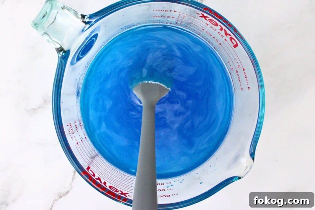 add blue jello and whisk until fully dissolved then add vodka