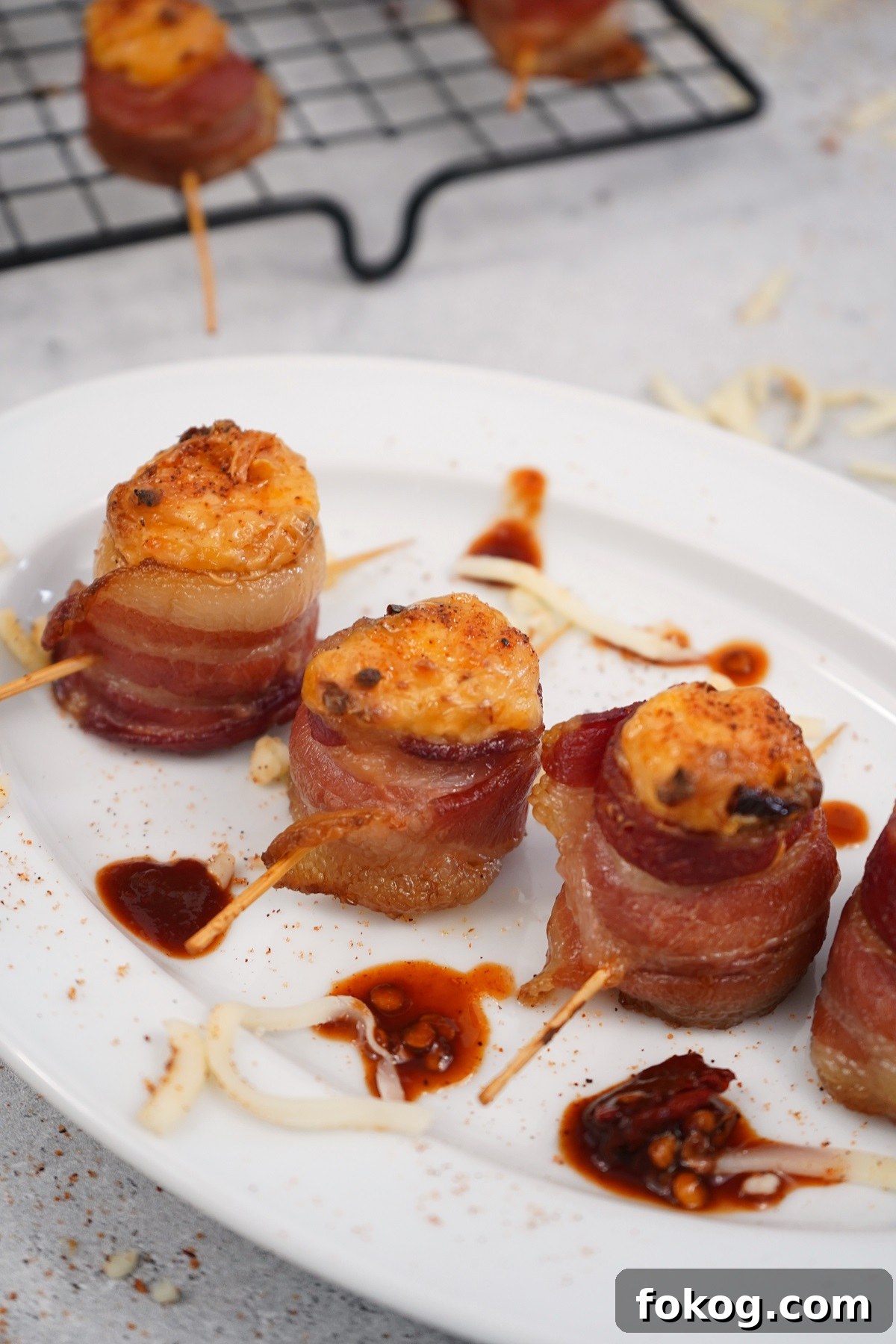 Chipotle smoked pig shots on white plate. 