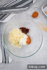 Make the filing by adding the cream cheese cheese chipotles and ½ the rub into a mixing bowl