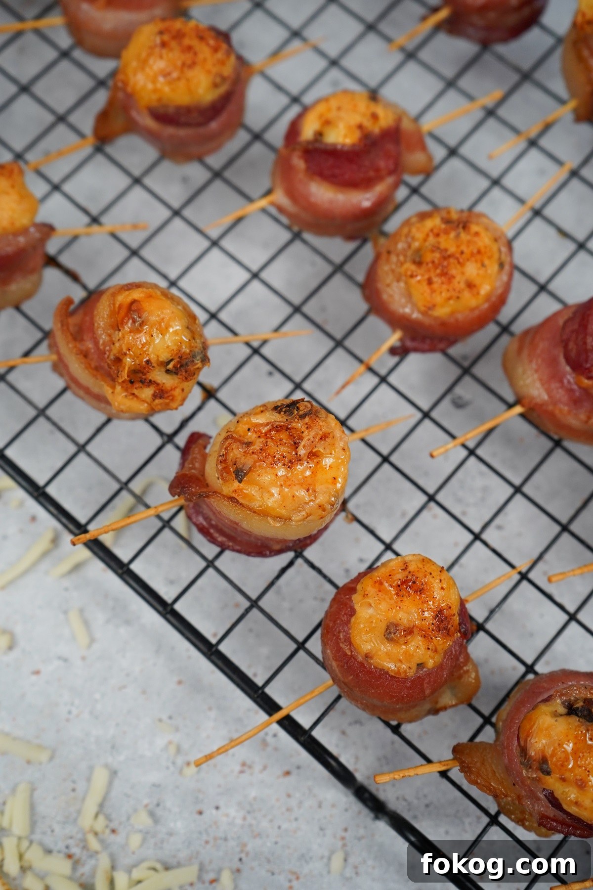 Chipotle smoked pig shots on rack with toothpicks. 