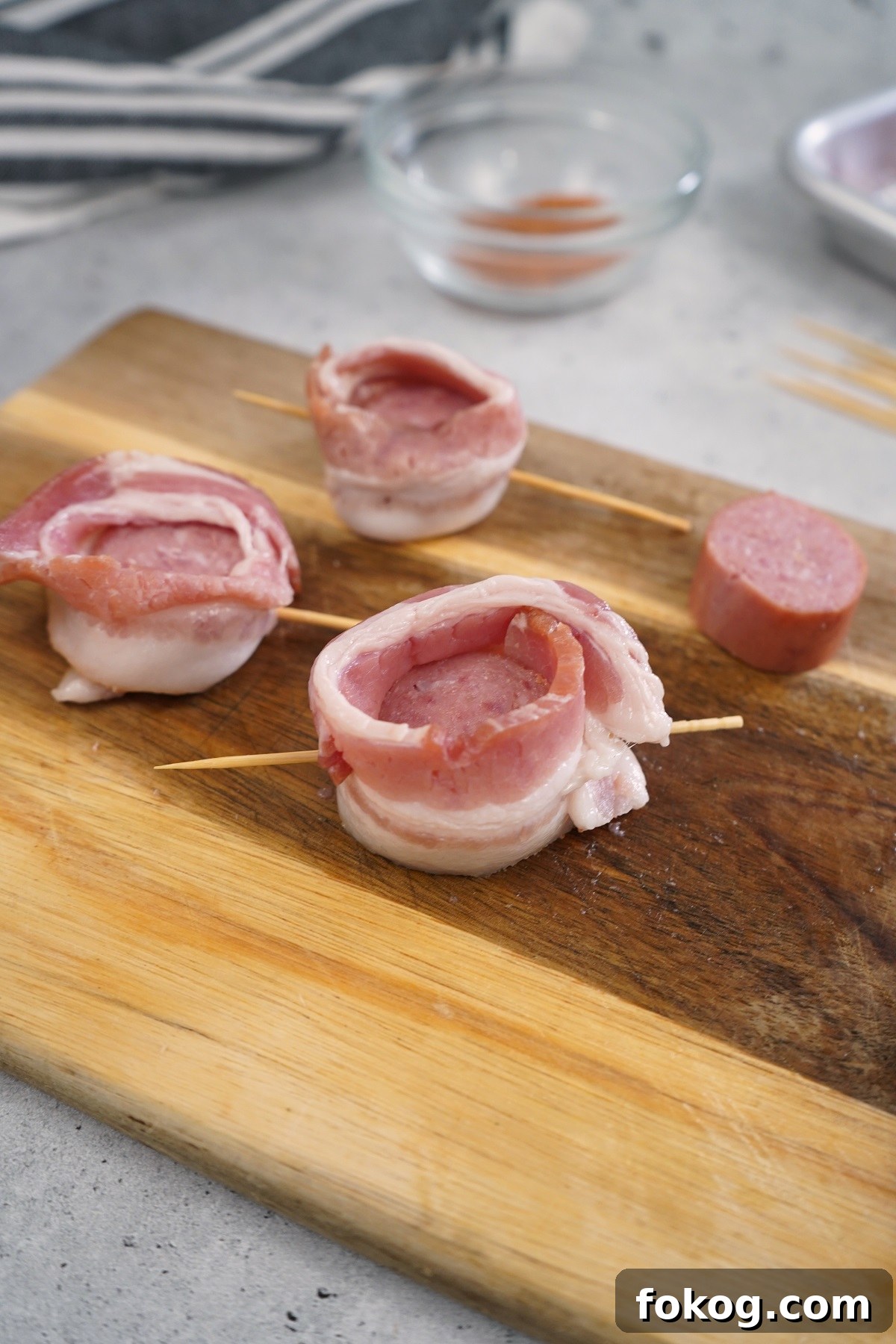 Secure the bacon with a skewer or toothpick through the bottom
