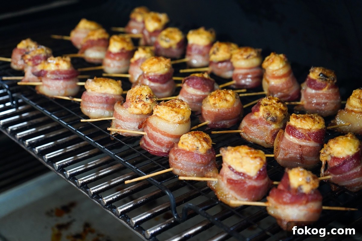 Chipotle smoked pig shots ready on grill grates. 
