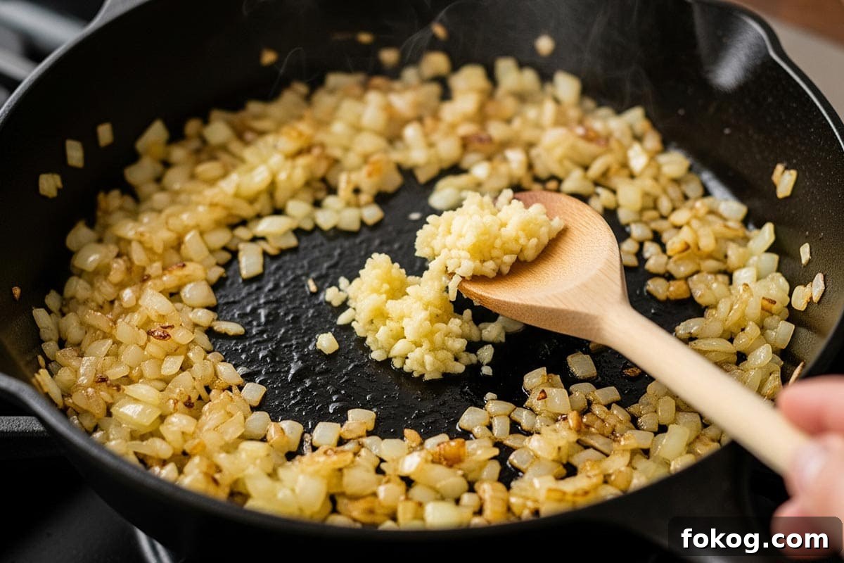 Cooking the onion and garlic in a skillet.