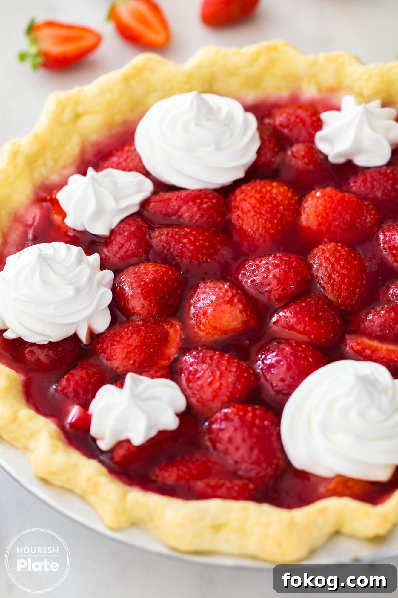 Fresh Strawberry Pie Recipe: Classic No-Bake Summer Dessert 3 Angle shot of a fresh strawberry pie with fresh whipped cream decorations