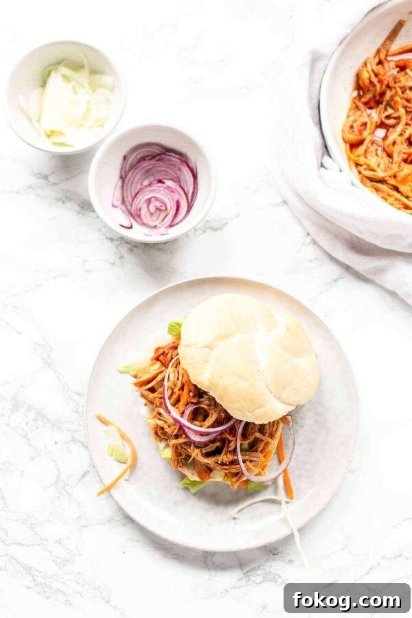 If you love pork try this Instant Pot Pulled Pork Sandwich recipe. Set and forget and within an hour you have juicy and soft pulled pork smothered in a thick barbecue sauce. Serve it on a Kaiser roll with lettuce and your favorite condiments. Great to serve for lunch or dinner.