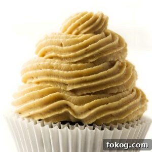 Close-up of cupcake with peanut butter cream cheese frosting.