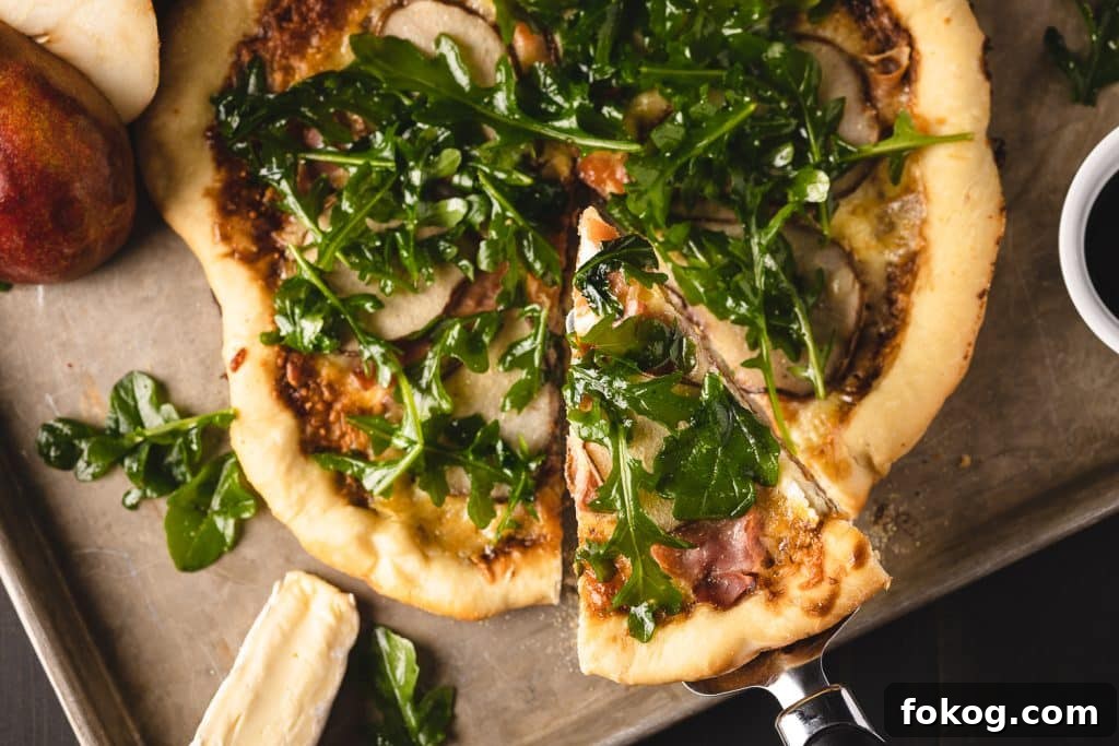 Sliced Dutch oven pizza on a wooden cutting board.