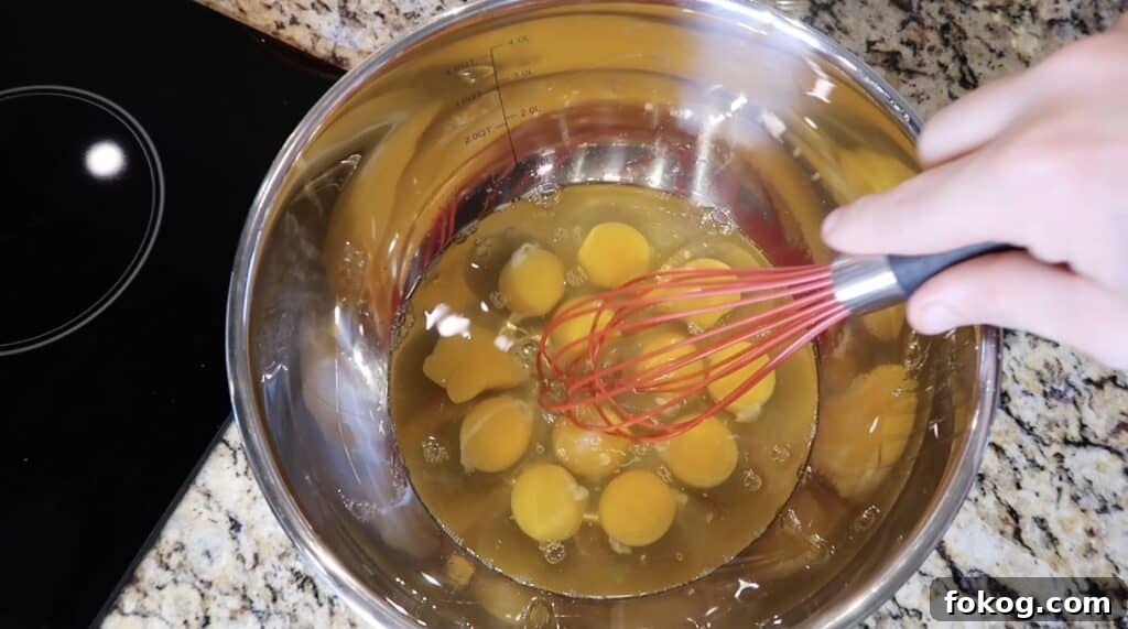 Spanish Omelette Scramble Recipe: Quick Tortilla Española Twist 10 eggs in bowl with whisk
