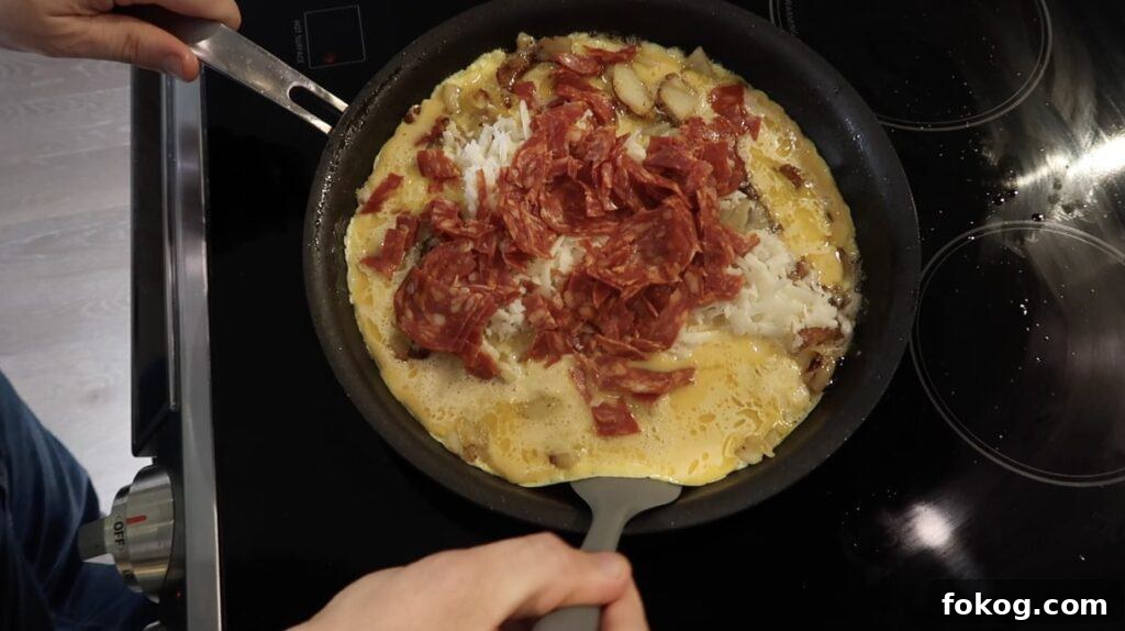 Spanish Omelette Scramble Recipe: Quick Tortilla Española Twist 19 scrambling with spatula