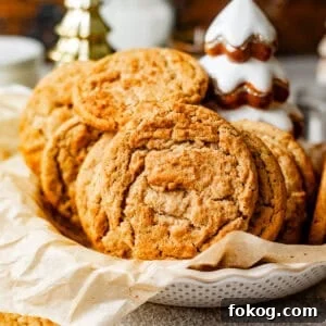 brown butter snickerdoodle cookies in a large bowl lined with parchment paper.