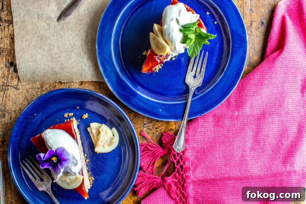 cheesecake slices on blue plates that are next to a pink cloth