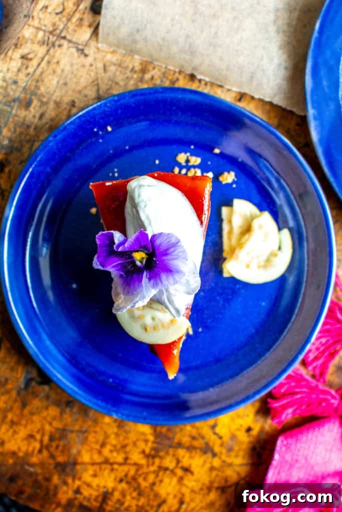 A slice of guava cheesecake on a blue plate.