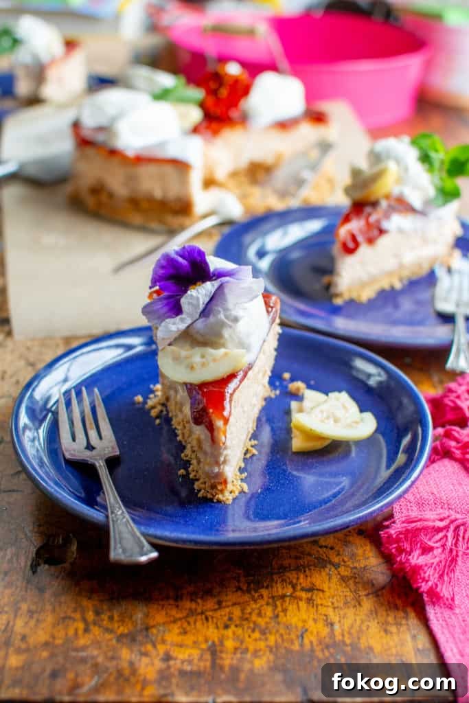 A slice of guava cheesecake on a blue plate with a fork on the plate. 