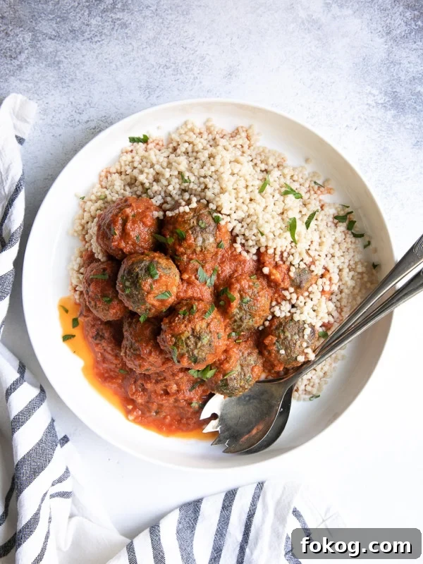 Middle Eastern lamb meatballs in a saffron tomato sauce on couscous.