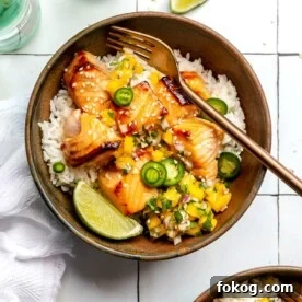 Chili-Lime Seared Ahi Tuna with Cilantro-Lime Sauce 13 A bowl of white rice topped with teriyaki salmon and mango salsa