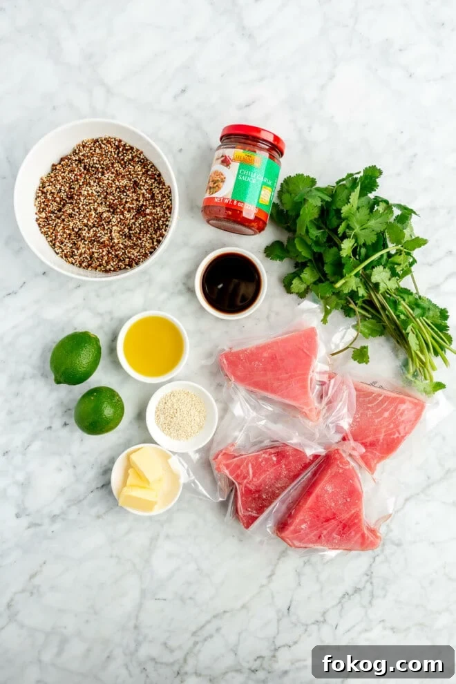 Chili-Lime Seared Ahi Tuna with Cilantro-Lime Sauce 3 All of the ingredients needed for chili-lime seared ahi tuna steaks sitting on a marble surface.