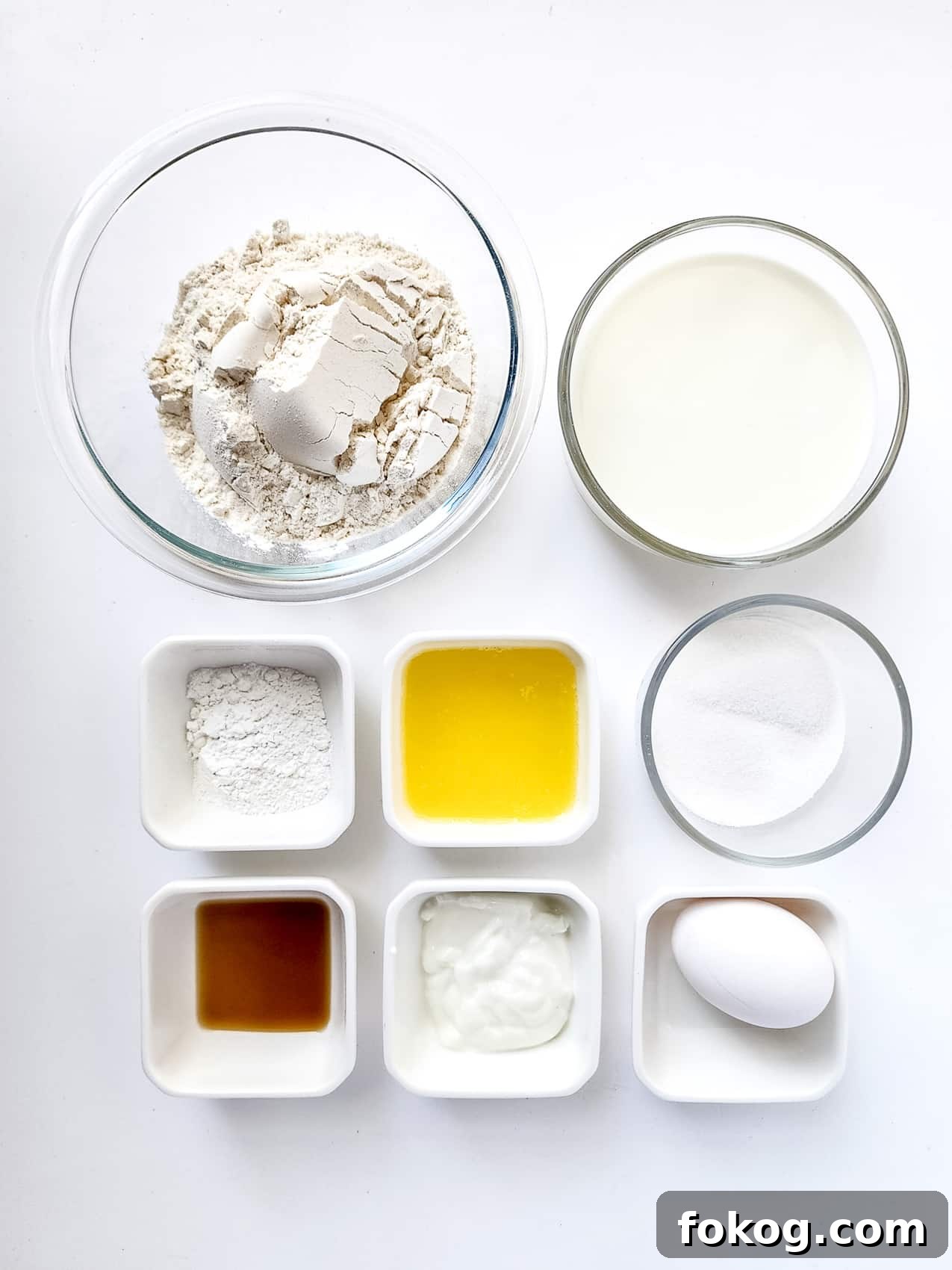 TikTok Viral Spaghetti Pancakes Recipe You Have to Try 3 all the ingredients for spaghetti pancakes in separate small glass dishes on top of a white background.