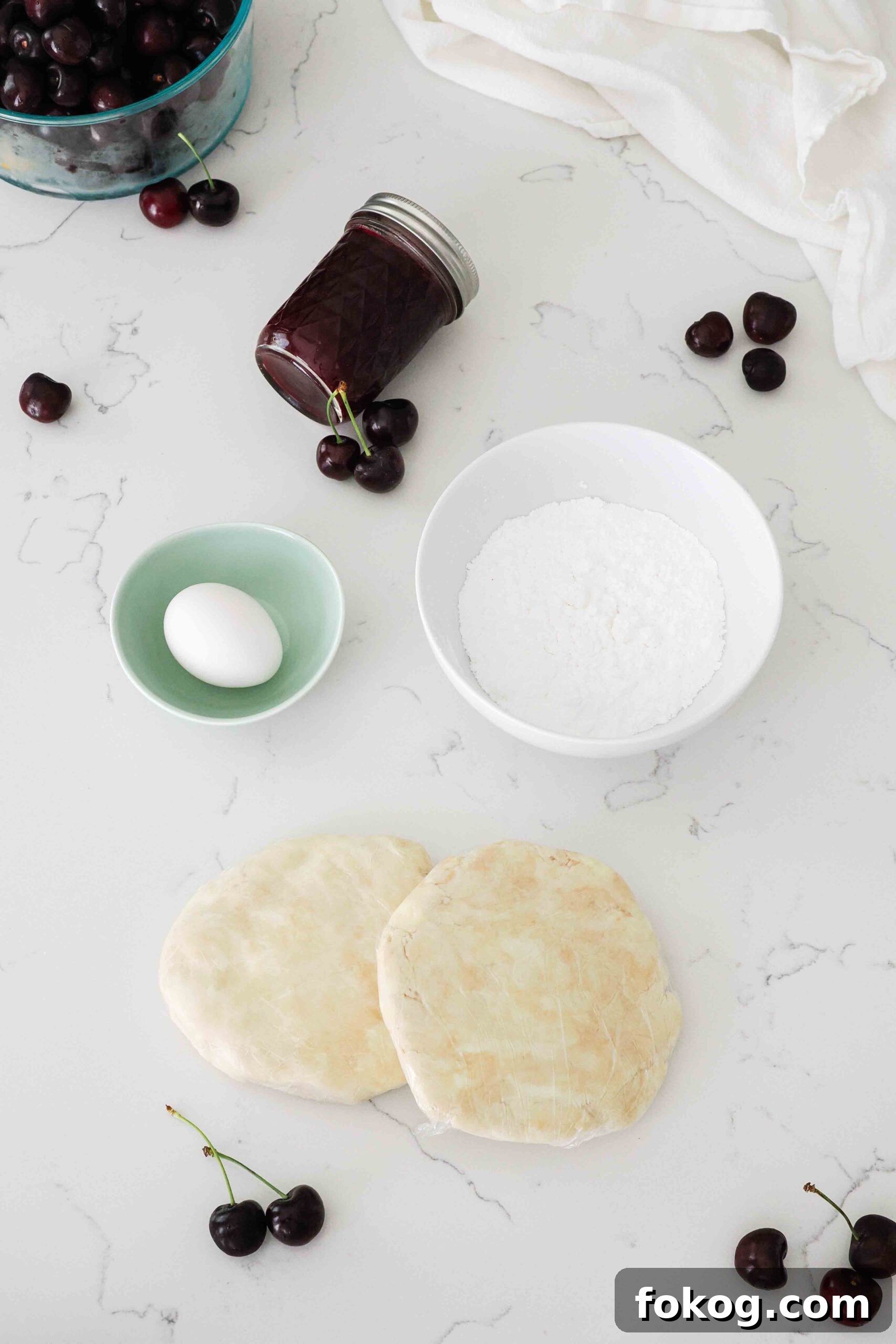 Ingredients for cherry Pop Tarts on a kitchen counter.