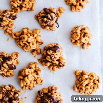 3-Ingredient Peanut Butter Cereal Energy Bites 13 Peanut butter bites on a baking sheet.