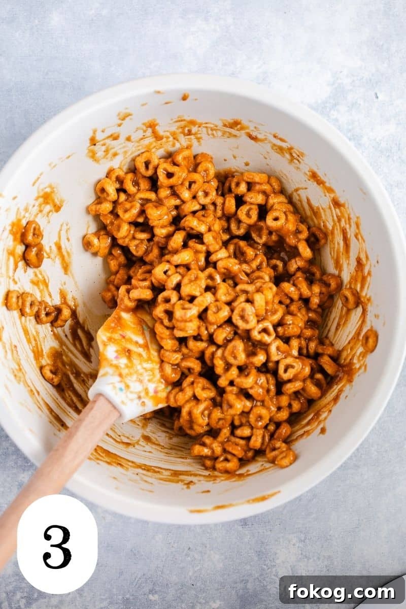 3-Ingredient Peanut Butter Cereal Energy Bites 6 Cheerios coated in a peanut butter.