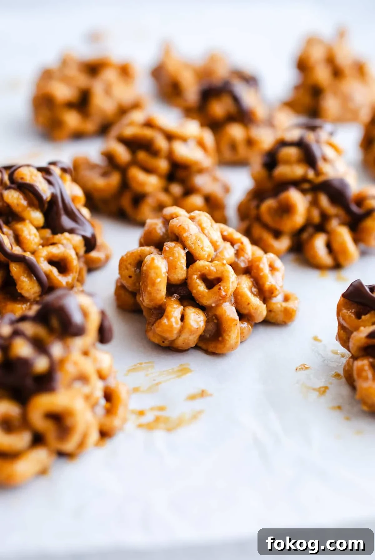 3-Ingredient Peanut Butter Cereal Energy Bites 8 Cereal bites on a piece of parchment paper.